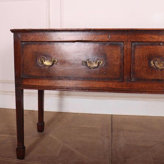 Good 18th C oak 3 drawer dresser base, very good colour. 1780 This piece is designed in the style of the selected designer...