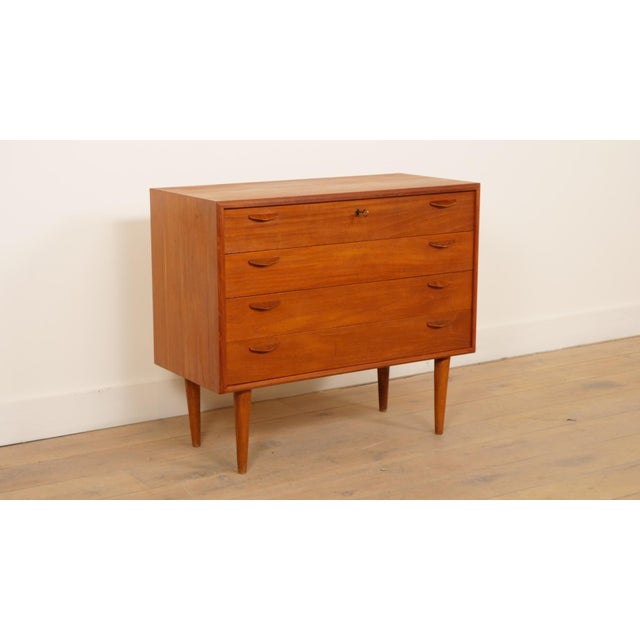 Danish vintage chest of drawers, which stands out for its beautiful sleek design. The stylish handles on the drawers, the...