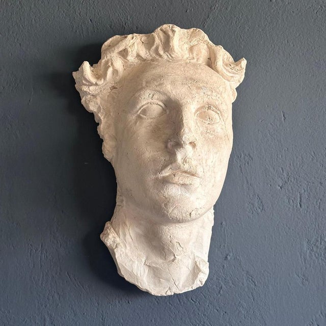 Transport yourself to ancient Rome with this exquisite decorative gypsum face, a faithful reproduction from the 1970s that...