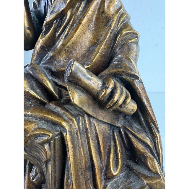 This is a late 19th century grand tour classical French bronze. This French bronze is a classical figure seated in a...