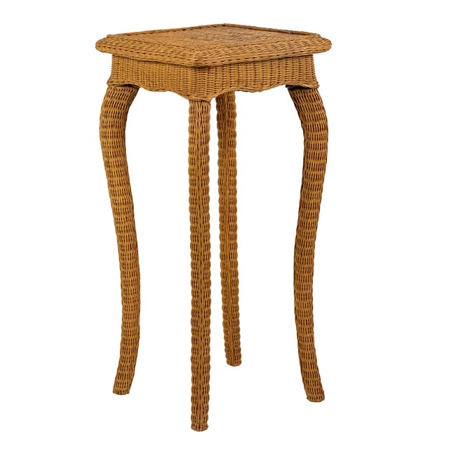 Vintage 1960s tall wicker plant stand with four dramatically wavy cabriole legs over a wood core, wrapped in tightly woven...