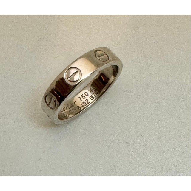 Authentic Cartier Love One Diamond Ring Engraved Cartier 750 46 CO6492 *ITO 0ne round diamonds This gorgeous ring has been...