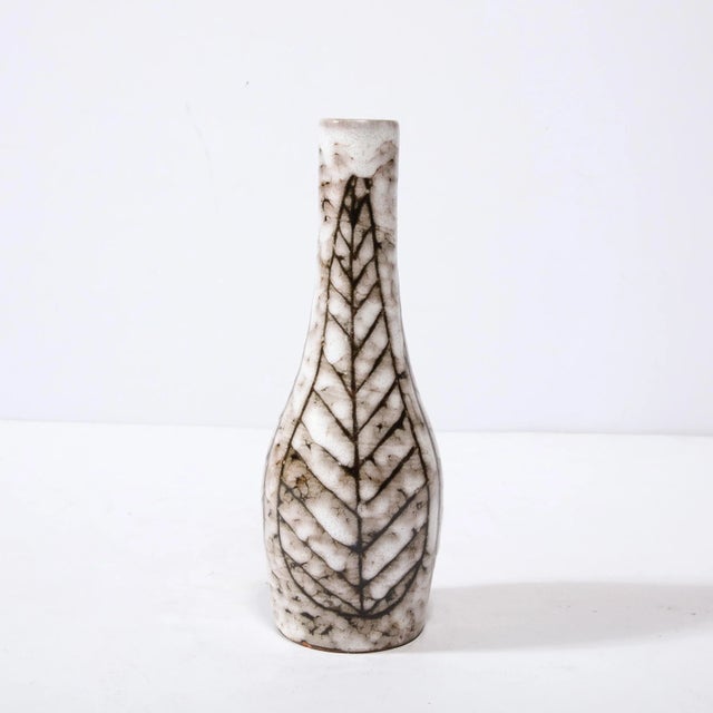 This Mid-Century Modernist Tapered Ceramic Vase with Linear Leaf Motif is a beautiful example of Post War European...