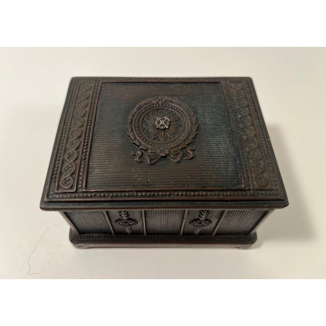 Antique 19th-century decorative metal box by Jennings Brothers (JB), marked “JB 1880” on the bottom. This charming antique...
