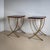 Two side tables by Luigi Caccia Dominioni on crossed, curved legs made of polished brass and rectangular wooden tops with...