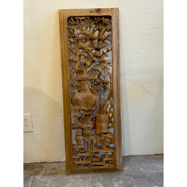 Standout pair of Asian Panel carved with open fretwork depicting foo dogs, flowers, birds, and elephants.