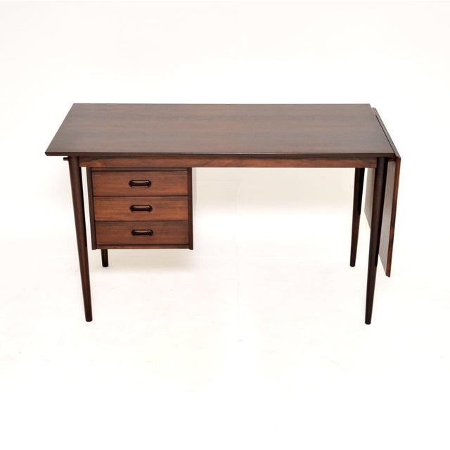 A stylish and extremely well made vintage Danish drop leaf desk, dating from the 1960’s. This is of amazing quality and...