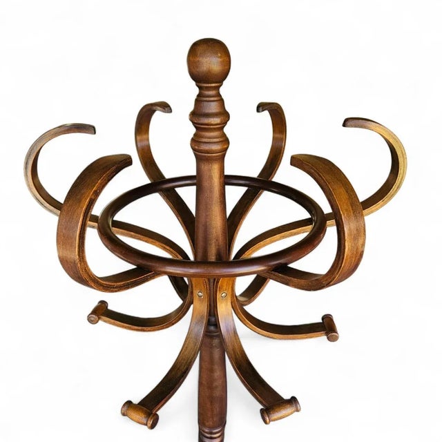 This vintage bentwood coat and hat rack is a timeless classic, inspired by traditional European hall tree designs. It's...