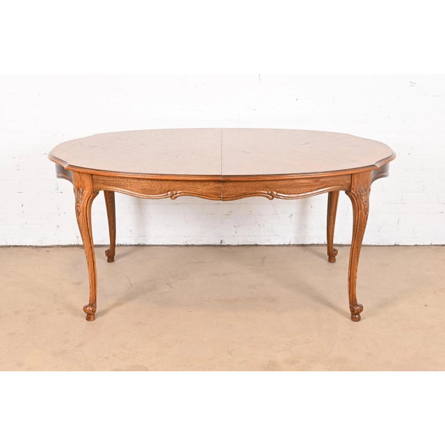 19th Century French Carved Oak Drop-Leaf Oval Table on