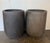 A striking and highly architectural pair of monumental tall cylinder planters, embodying pure, modern minimalism and quiet...