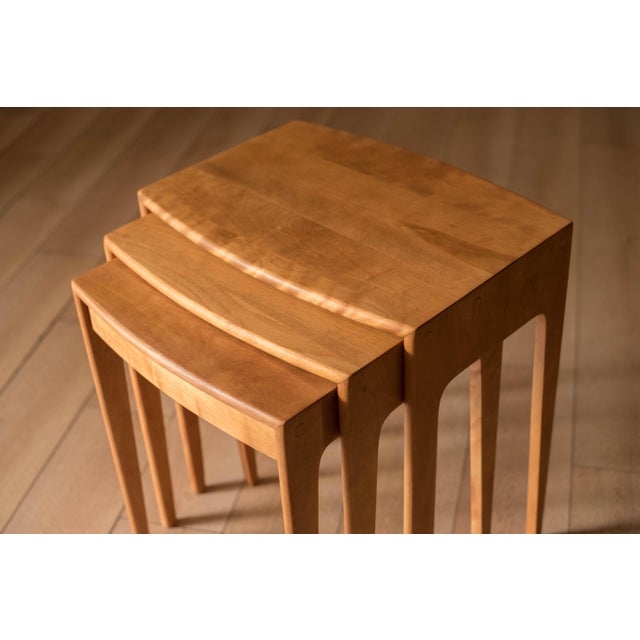 Mid century modern nesting tables model no. 312-G in solid birch wood by Heywood Wakefield Co. This versatile set features...