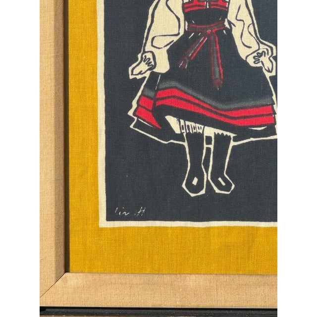 A striking mid-century Scandinavian textile by artist Liv Hassel, featuring a stylized folk figure rendered in bold,...
