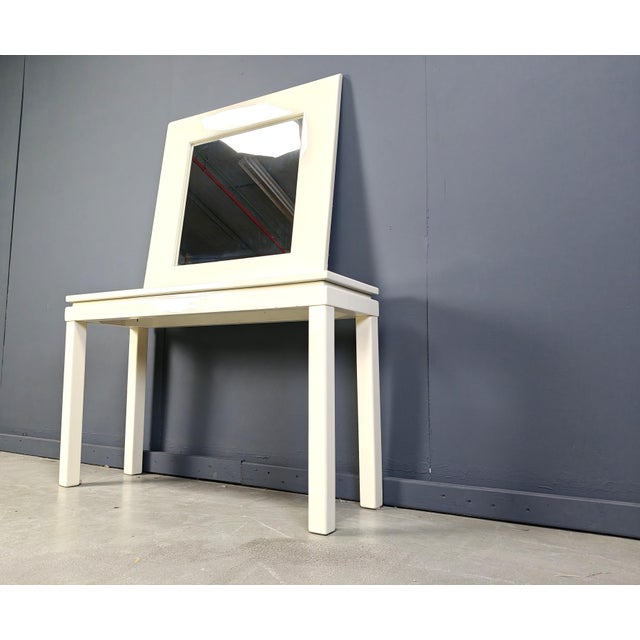 Vintage beige lacquer console table with matching mirror. In the style of Jean Claude Mahey. Probably by roche Bobois....