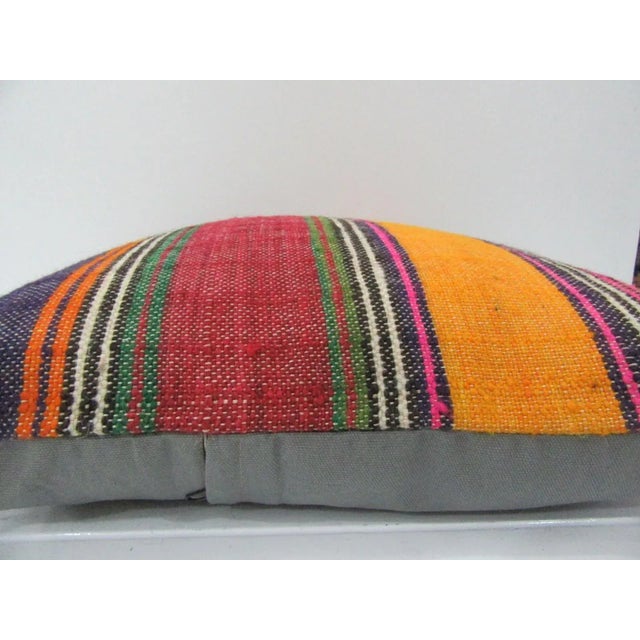 This is a pillow cover made from a vintage kilim rug. The piece was properly washed and ready to use. Pillow inserts not...