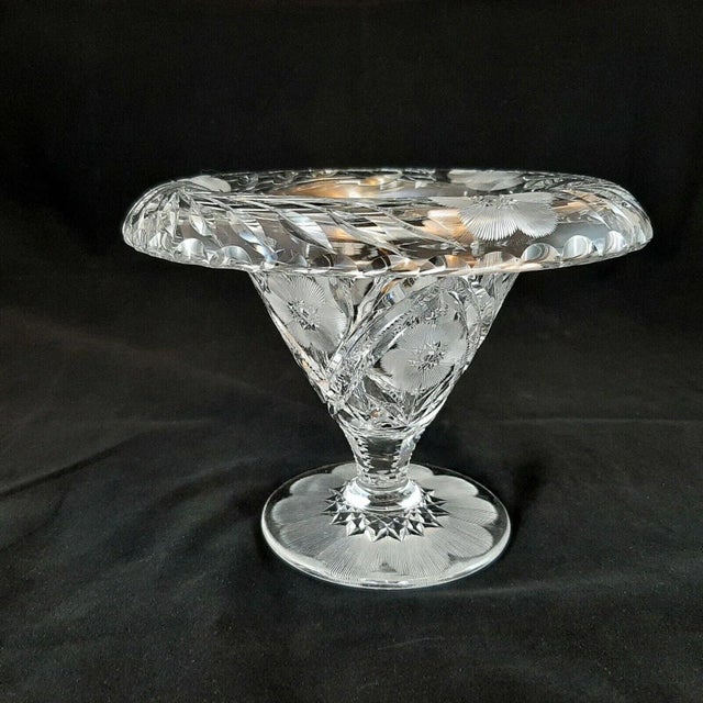 The item offered is a stunning antique ABP American Brilliant Cut Crystal Footed Folded Rim Compote/Vase with cut flowers...
