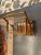This is a 1950s Ico Parisi Inspired bar cart. The wood is walnut. It has three shelves. The top two shelves have glass in...