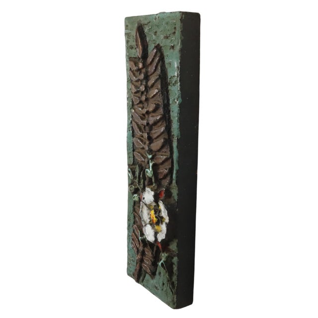 Abstract vintage wall sculpture, plaque made of partially glazed terracotta, depicting leaves and a flower with twigs, fat...
