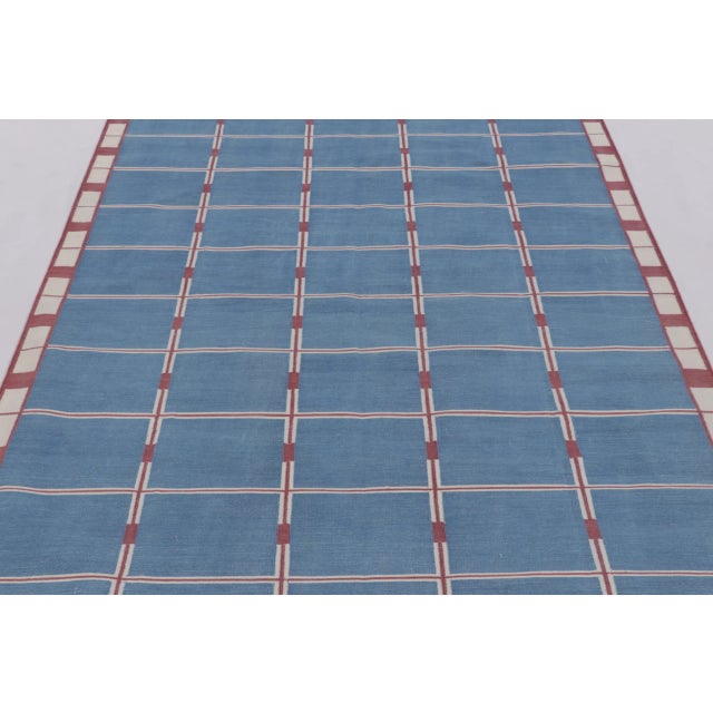 This 6x9 dhurrie, handwoven in cotton from India offers a refined interpretation of classic flatweave design through a...