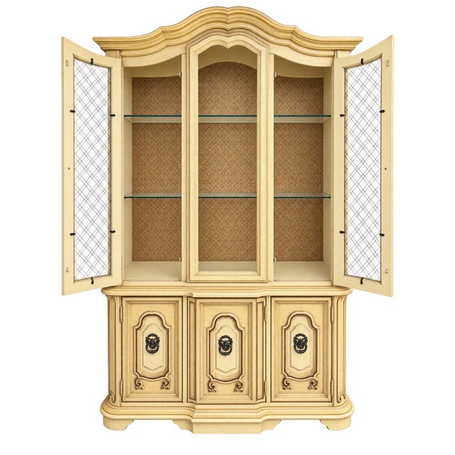 Vintage Stanley Furniture French Provincial China cabinet/hutch in an antique ivory/cream distressed finish. Notable...