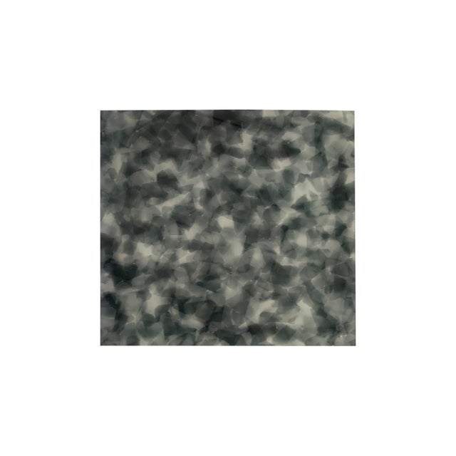 This table is created by layering glass chips of different colors together and then melting them into a colorful and...