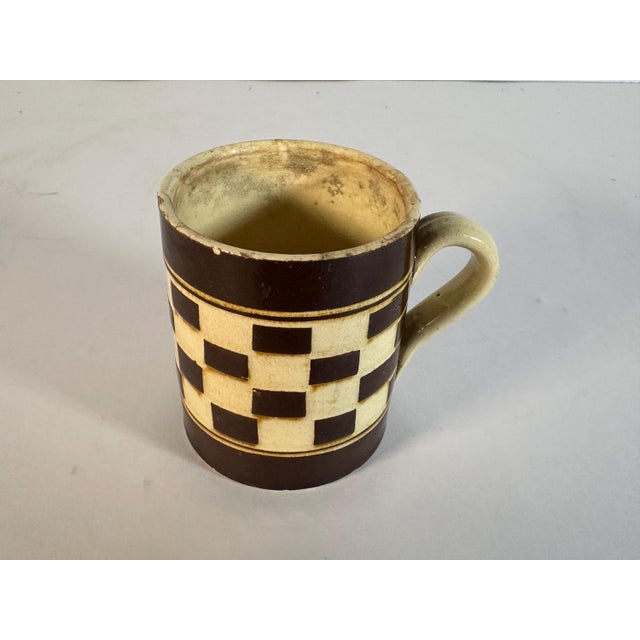 Antique Child's Mochaware Checkered Mug for your consideration. The mug measures approx. 2 7/8 inches tall and approx. 3...