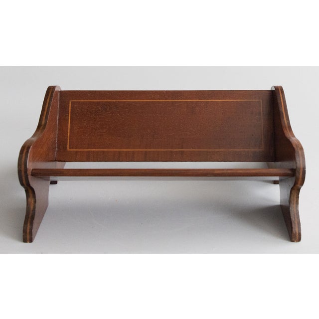 A fine antique English Edwardian mahogany handmade tabletop book trough or book rack with satinwood inlay, circa 1900. It...