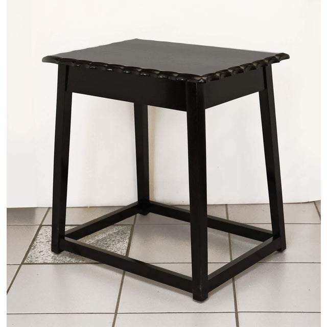 Art Nouveau table made around 1910. Oak legs with recessed joints. Tabletop with scalloped edge. Stained black....