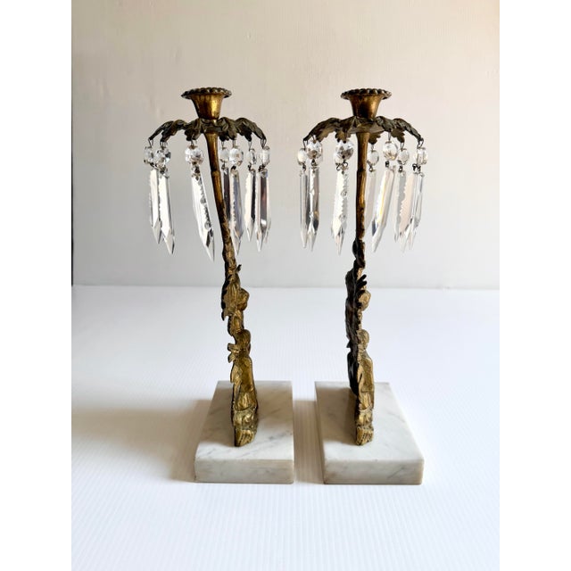 Pair of antique brass and marble girandole candle holders, featuring a cast bronze Victorian boy and girl.