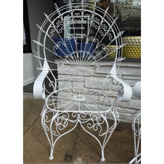 Beautiful vintage peacock chairs, attributed to Salterini, offered as a set of two. The set includes one classic...