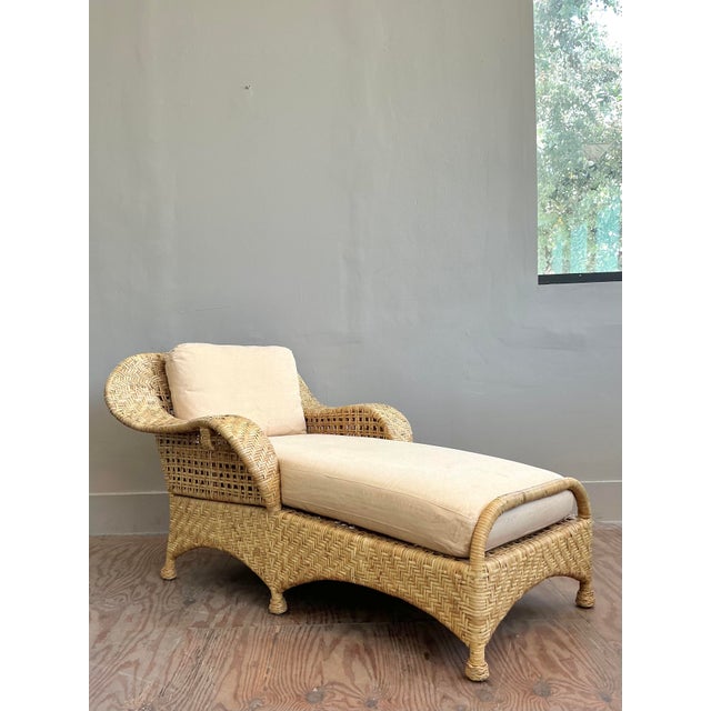 Indulge in unparalleled relaxation and iconic design with this vintage McGuire Woven Rattan Chaise Lounge, a true...