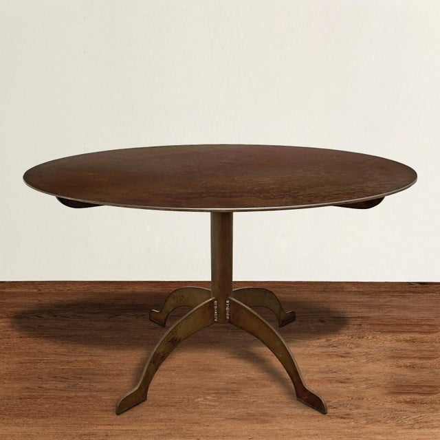 An incredible artist-made steel round dining table oozing Shaker design principles of honesty, utility, and simplicity,...