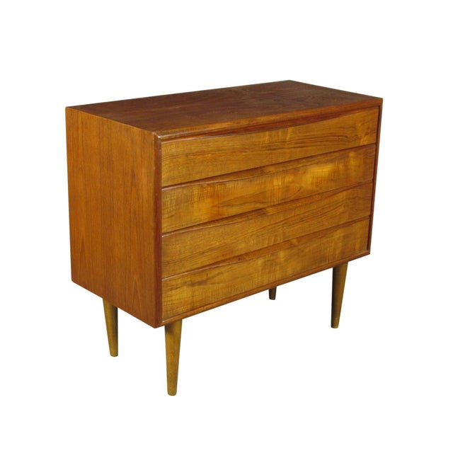 A Swedish MId Century Modern teak chest of drawers with four long drawers and rich original patina.