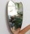 Mid-century italian wall mirror with brass frame (circa 1950s). The mirror is classically-shaped and distinctive in a...