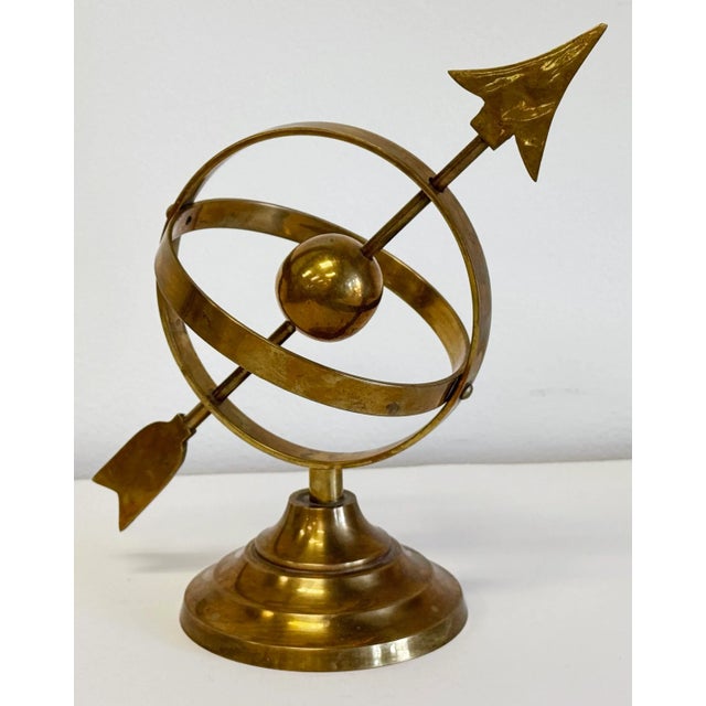 Vintage brass armillary sundial sphere atop a tiered brass base. Classic office, bookshelf, desktop or coffee table decor...