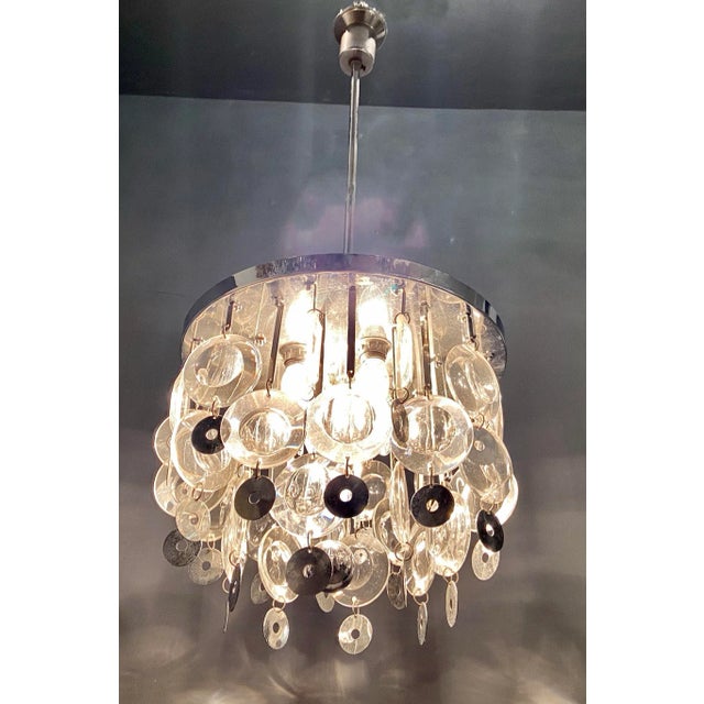 Midcentury Glass Optical Lens Chandelier Typical of Oscar Torlasco designs this chandelier features optical glass lenses...