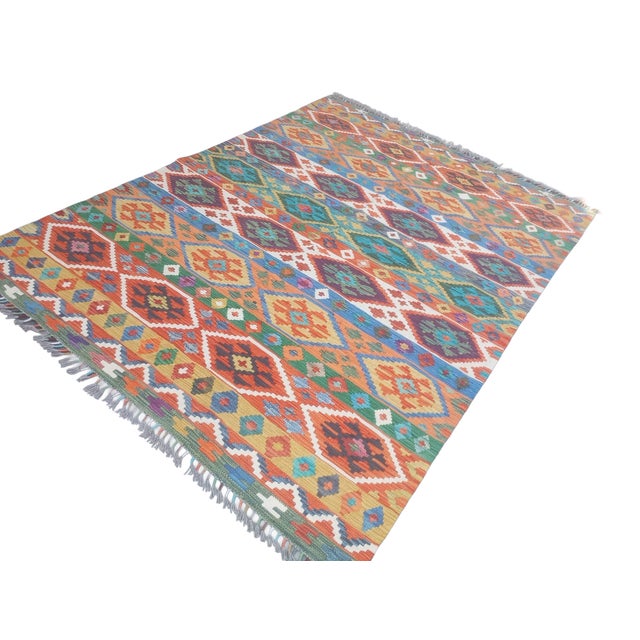 stunning and vibrant vintage authentic Anatolian flatwoven kilim, handcrafted approximately 50–60 years ago by skilled...