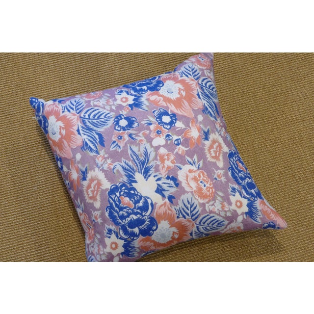 Multi-colored patterned floral pillow in lilac, blue, and coral. Pattern on both front & reverse. Hidden zipper closure &...