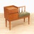 This vintage entryway bench was produced in England during the 1960s. With a wonderful minimalist teak design the seat...
