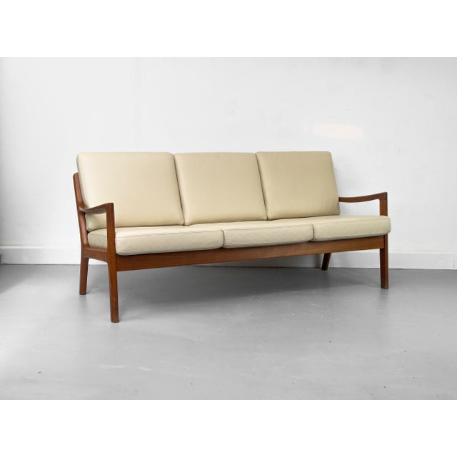 Senator Lounge Sofa in a beautiful design, crafted from solid, reddish-brown teak with a lovely grain, designed by...