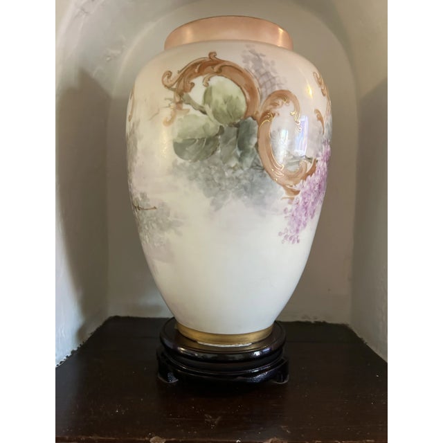 Stunning hand painted 19th century vase. Featuring draped wisteria flowers and vines. This item is solely used for...