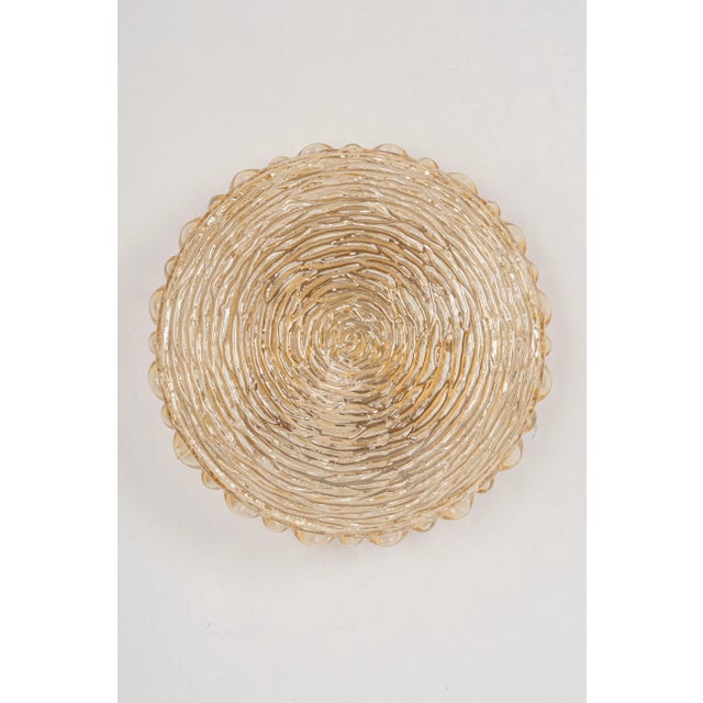 Pair of amber glass sconces in thumbprint shape, germany, 1970s very good condition. Cleaned, well-wired, and ready to...