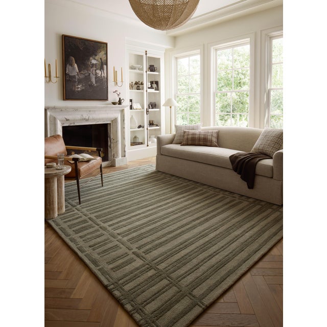 The Bradley Collection from Chris Loves Julia x Loloi takes the classic striped rug to new heights. This hand-tufted, 100%...