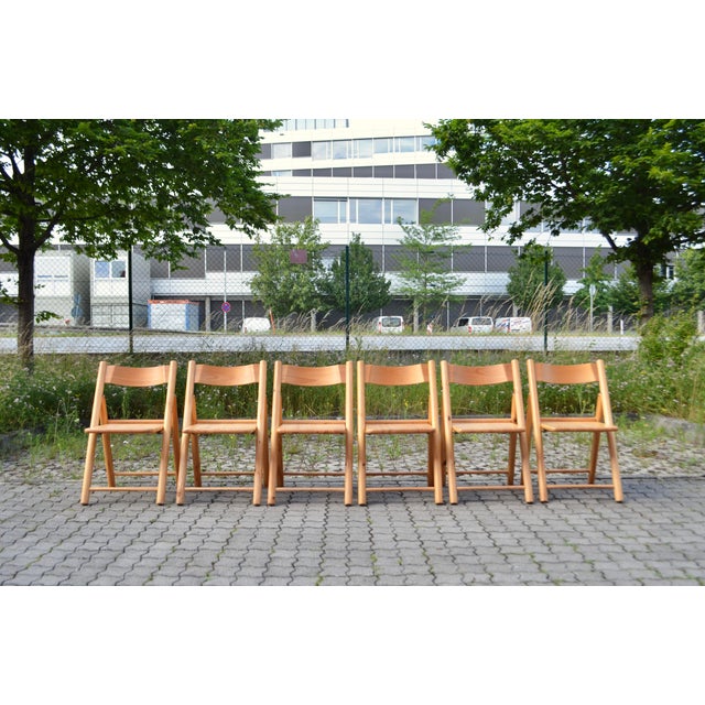 Authentic Danish folding chair crafted from solid Scandinavian pine. The chair features a beautiful warm honey-colored...