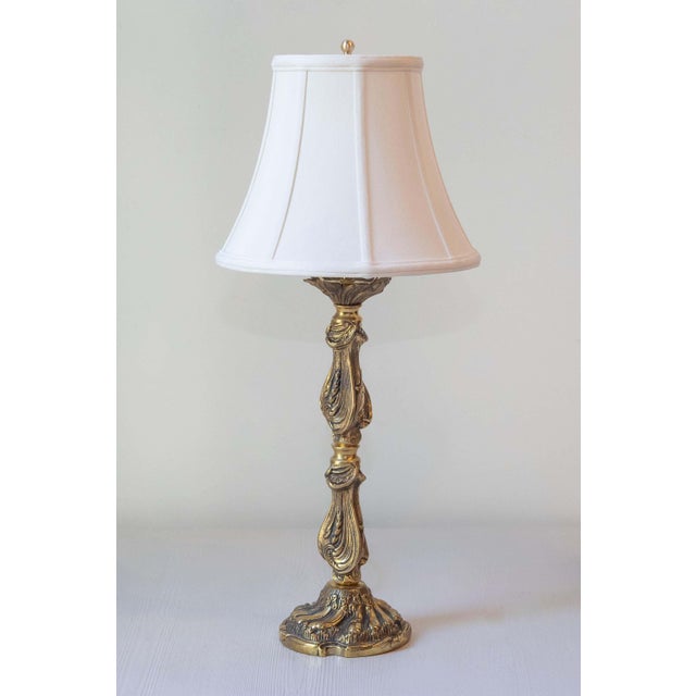This large Art Nouveau-style candlestick, crafted in polished bronze with a golden hue, has been beautifully repurposed as...