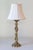 This large Art Nouveau-style candlestick, crafted in polished bronze with a golden hue, has been beautifully repurposed as...