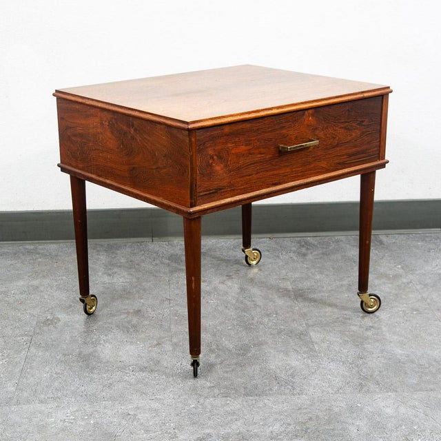 Well made rosewood craft cart / serving trolley. Very fine details and construction. The piece sits casters and rolls...