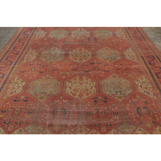 This antique 10x15 Turkish Anatolian rug, hand-knotted in wool circa 1900-1909, features a striking all-over lattice of...