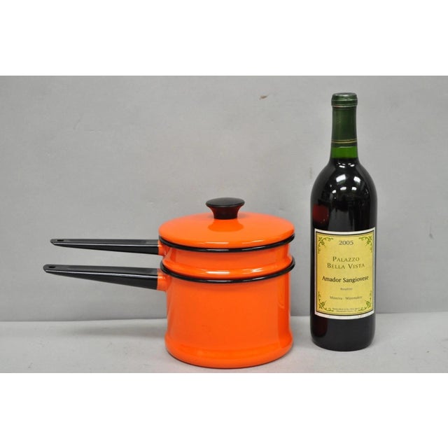 Vintage Enamel Orange & Black Metal Double Boiler Nesting Pot w/ Lid. Circa Mid 20th Century. Measurements: 7" H x 11" W x...