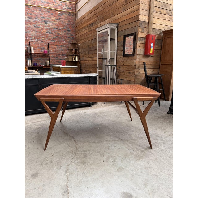 This table, with its graphic design, was designed by Louis Paolozzi and produced by René Godfrid in 1955. It has been...
