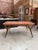 This table, with its graphic design, was designed by Louis Paolozzi and produced by René Godfrid in 1955. It has been...
